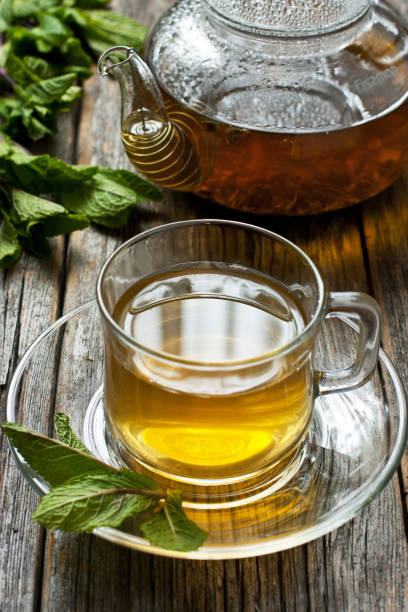 istock Glass cup of mint tea with mint leaves 1219599409