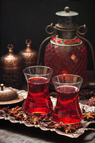 istock Hibiscus tea in traditional turkish glass cup on copper tray 1219599478