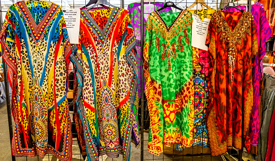 This pio shows Traditional African Curios and clothing hanging. The pic is taken in johannesburg in day time and in month of march 2019. Pic shows colorful African Curios.