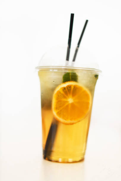 Isolated Front View of Thai Iced Lemon Tea in plastic cup with