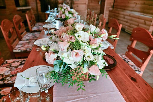 Celebration banquet table in rural style with flowers