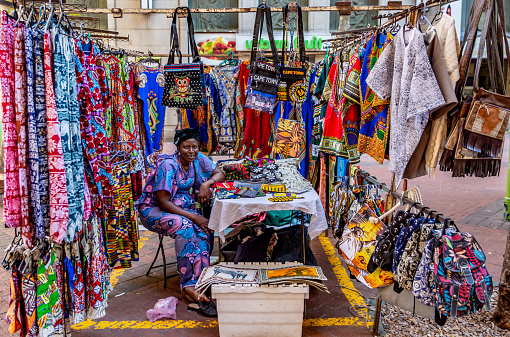 This pic shows Street market in capetown of South Africa. People are selling handmade colorful beads bracelets, bangles in the open street market. The pic is taken in march 2019 and in day time.