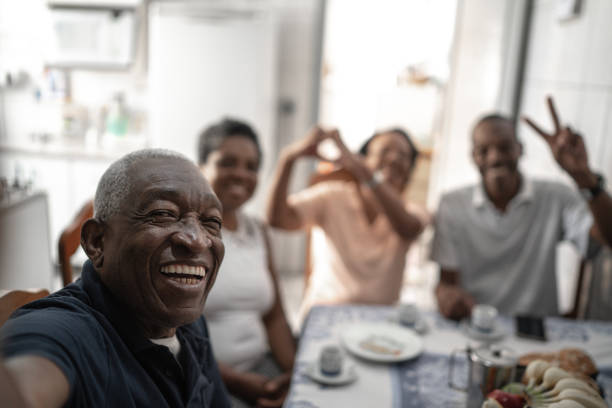 istock Family taking a selfie at table 1219610007