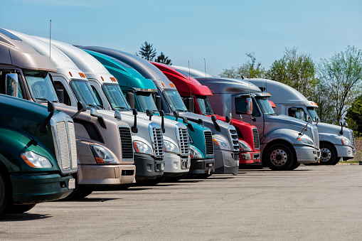 Group of trucks parked at truck stop, American transport concept, Missouri, United States.