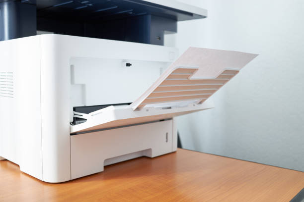 istock workplace with close up view to copy machine at office. paperwork, stationery and procrastination concept. 1219612039