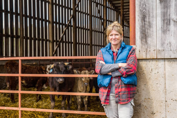 istock A female cattle farmer standing outside of a barn 1219614884