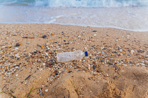Plastic water bottles pollution on beach
