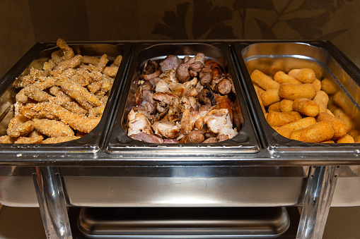 Variety of meals in luxury hotel buffet.