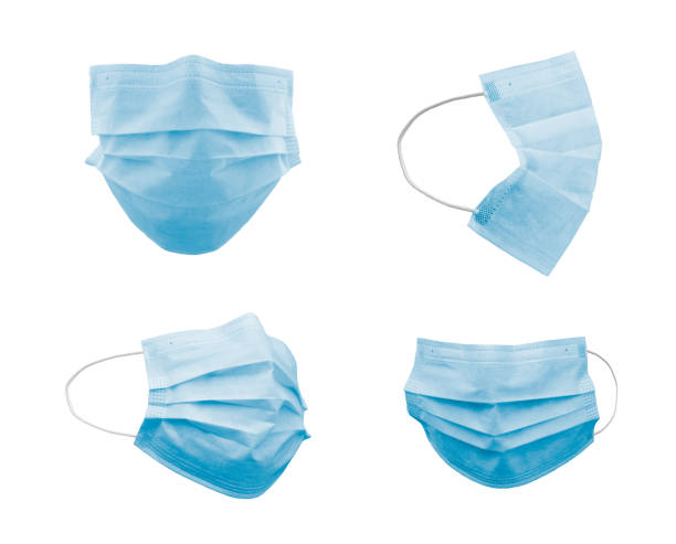 白で分離された異なる角度での青い医療用フェイスマスクのコレクション - different angles ストックフォトと画像