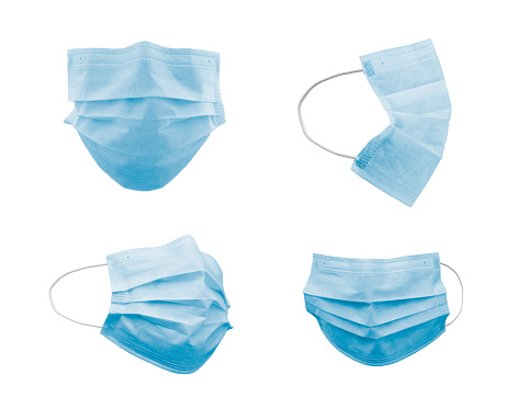 Collection of Blue Medical Face Masks At Different Angles Isolated on White.