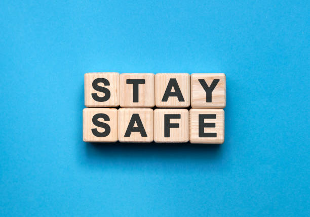 istock STAY SAFE - text on wooden cubes on a blue background 1219617553