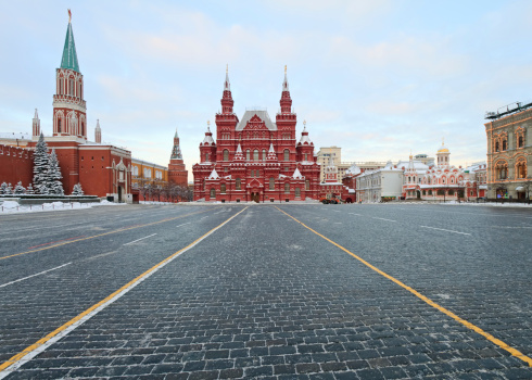 Red Square. Spasskaya tower with a clock on a background of blue sky. Vertical. Moscow, Russia