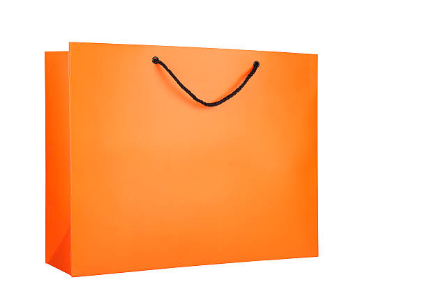istock Orange Shopping bag placed at an angle, isolated on white 121962386