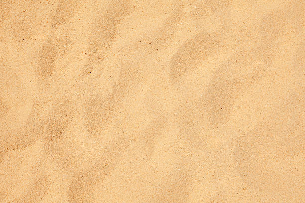 istock Close-up photo of beautiful light colored sand with texture 121963124