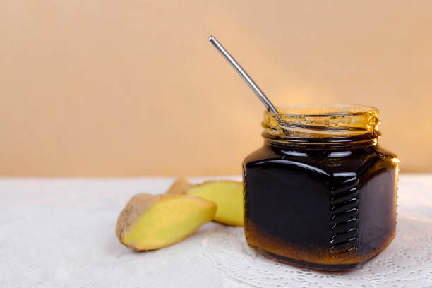 istock Buckwheat honey, sliced ginger and spoon 1219631797