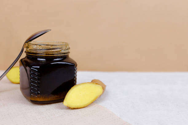 istock Buckwheat honey, sliced ginger and spoon 1219631819