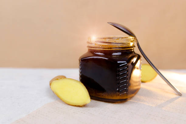 istock Buckwheat honey, sliced ginger and spoon 1219631845
