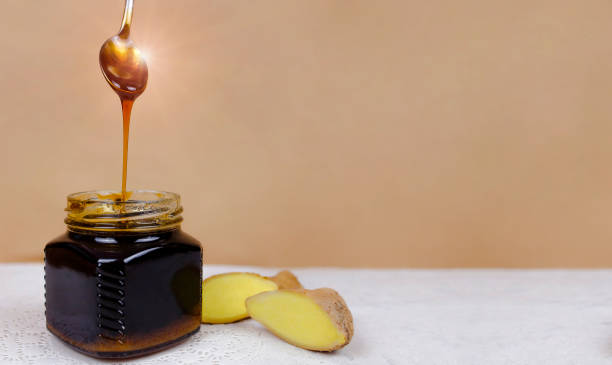 istock Buckwheat honey, sliced ginger and spoon 1219631852