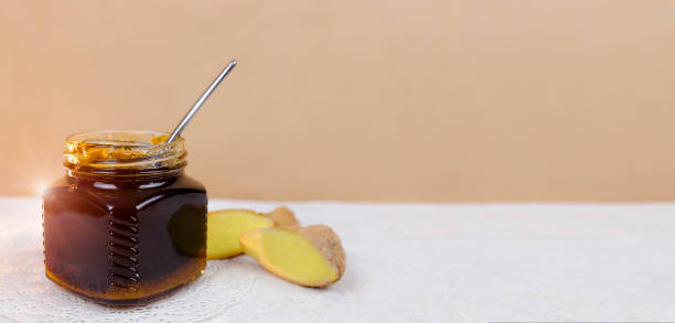 istock Buckwheat honey, sliced ginger and spoon 1219631860
