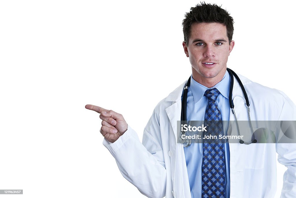 Doctor pointing to copy space Horizontal composition of Doctor pointing to copy space 30-34 Years Stock Photo