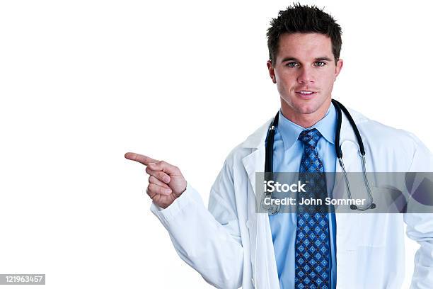 Doctor Pointing To Copy Space Stock Photo - Download Image Now - 30-34 Years, 30-39 Years, Adult