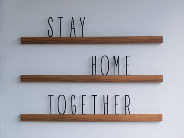 istock Welcome Greetings on Wood Stand Stay Home Together 1219635206