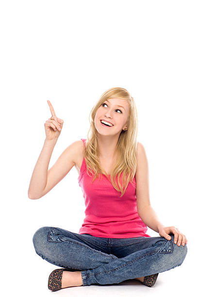 istock Young woman pointing up 121963557