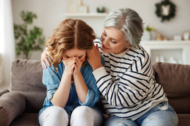 istock Senior mother comforting crying daughter 1219638586