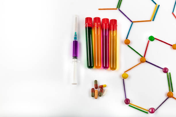 Coronavirus epidemic concept. Inscription COVID-19 against chemistry molecular model and laboratory equipment on white background.