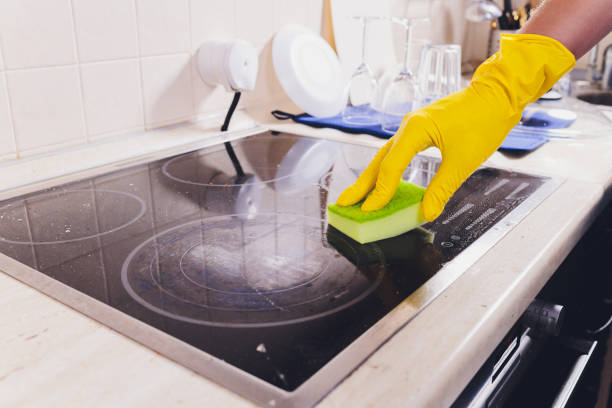 istock Cleaning kitchen hob with a steam cleaner. 1219641458