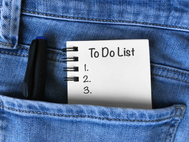 istock To do list, notebook and pencil in denim pocket. 1219641496