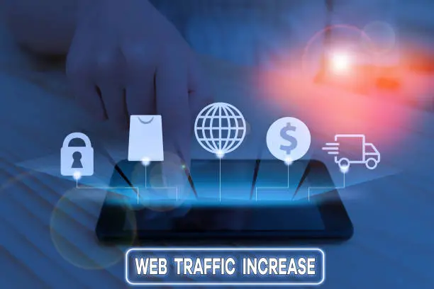 Photo of Writing note showing Web Traffic Increase. Business photo showcasing Expand Visitors to a Website a number of Visits.