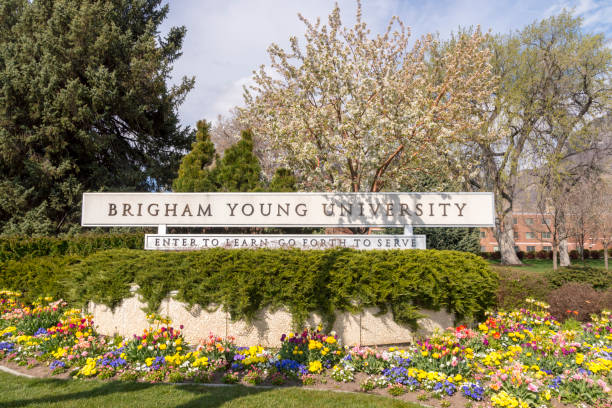 Welcome Sign Banner at the Edge of the Brigham Young University Campus Provo, Utah, USA - April 7, 2020: This is the sign at the entrance to the Brigham Young University.  During the spring and summer months, the area surrounding this sign is always covered in colorful flowers and is a popular place for taking graduation pictures. brigham young university stock pictures, royalty-free photos & images