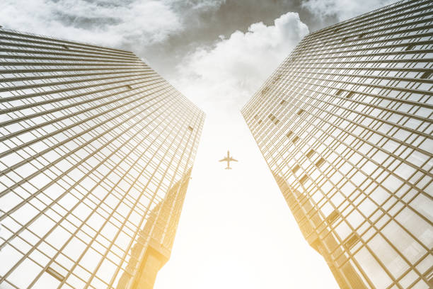 istock The plane flew through two symmetrical city buildings 1219652601