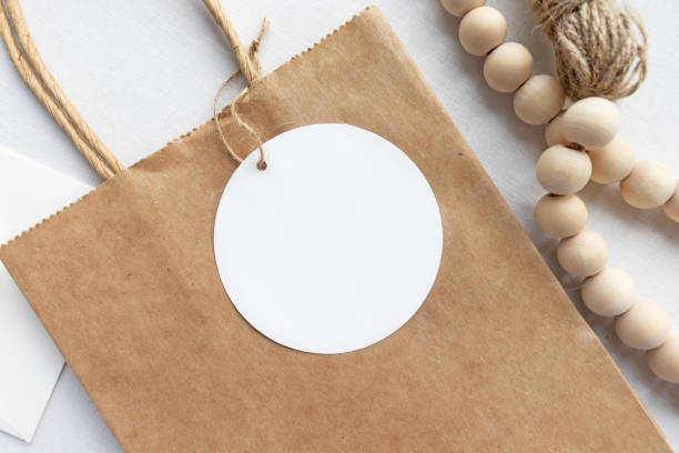 istock Blank round gift tag mockup flat lay - neutral tones 1219661787