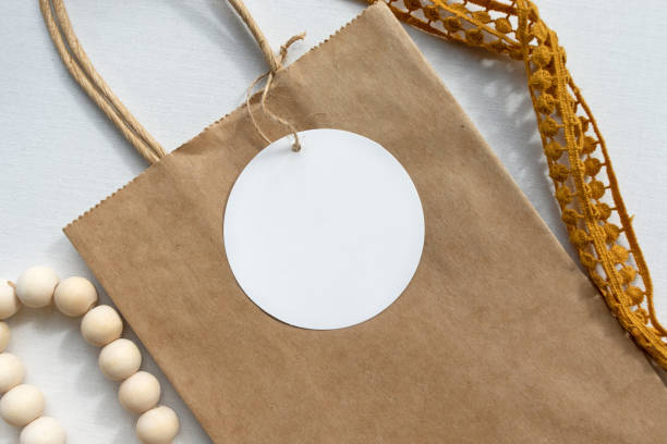 istock Blank round gift tag mockup flat lay - neutral tones 1219661823