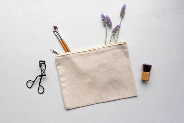 Blank makeup bag flat lay mockup cosmetic bag with lavender mockup make up bag stock pictures, royalty-free photos & images