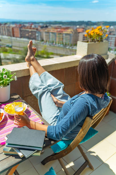 istock Student sunbathing with tapas at the balcony 1219666317