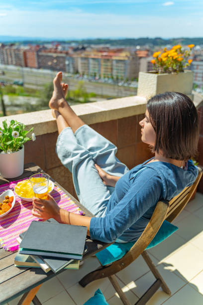 istock Student sunbathing with tapas at the balcony 1219666318