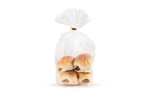Bread with sausage in plastic bag on white background and clipping path for using