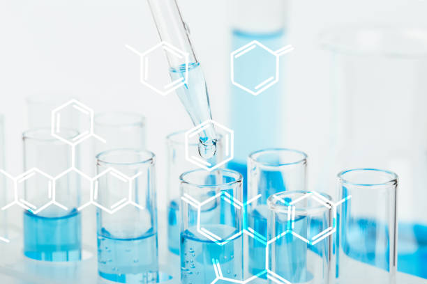 istock Laboratory glassware with a dropper dripping liquid into a test tube. scientific laboratory test tubes, laboratory equipment 1219670593