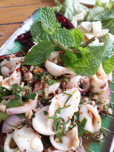 istock Spicy squids with vegetables is a kind of e-san recipe. 1219670733