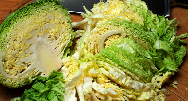 istock savoy cabbage cut into slices on wooden board 1219674108
