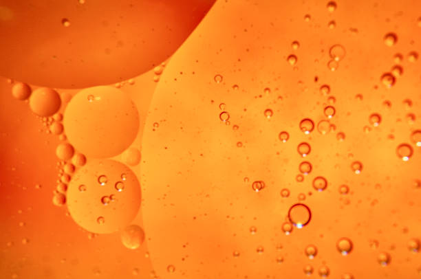 istock Sunflower oil bubbles drops in water 1219674142