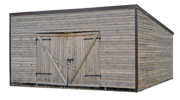 istock Wooden  aged rural locked  garage. Isolated 1219674265