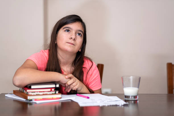 istock tired teenager student looking up 1219675108
