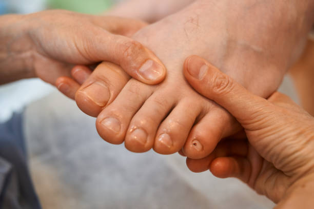 istock woman master pedicures a man. 1219677052