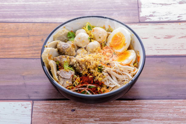 istock Hot chicken noodle on wooden table 1219681515