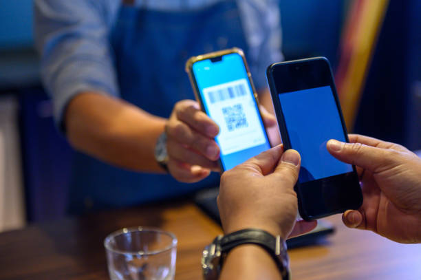 istock Cashless digital wallet payment with wireless devices at bar counter 1219681834