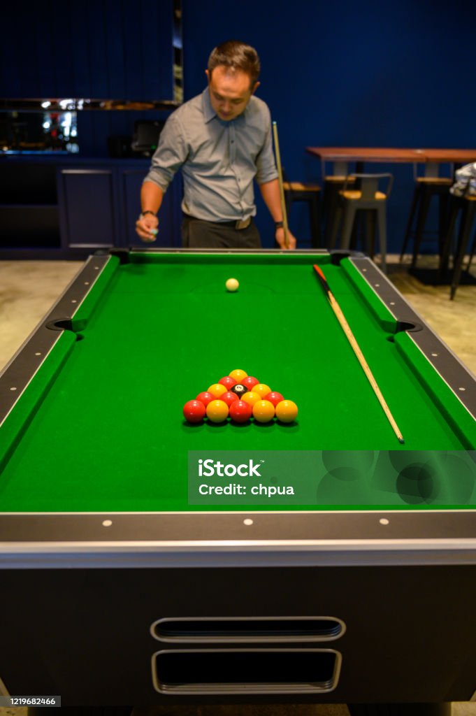 Man At Pool Table Man Playing Billiards On Pool Table Stock Photo - Download Image Now ...